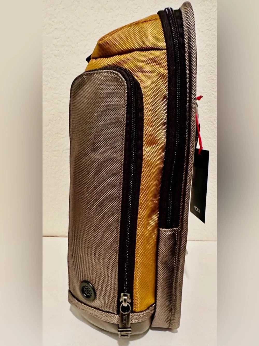 Brand New with Tag TUMI Higgins Sling Golden Brown Gray